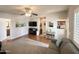 Inviting living room with hardwood floors, neutral colors, and a view to the bathroom and kitchen at 591 S Ironstone Dr, Apache Junction, AZ 85119