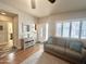 Living room with a couch, area rug, and cabinet with an entrance to the home's front door at 591 S Ironstone Dr, Apache Junction, AZ 85119