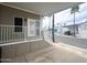 Spacious covered porch featuring white railings, offering shade and outdoor enjoyment at 591 S Ironstone Dr, Apache Junction, AZ 85119