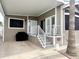 Inviting covered porch with white railings leading to the front door of this manufactured home at 591 S Ironstone Dr, Apache Junction, AZ 85119