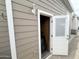 Exterior storage area through a light and bright door on a home with horizontal siding at 591 S Ironstone Dr, Apache Junction, AZ 85119
