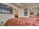 Beautiful bedroom with ceiling fan, flatscreen TV and closet with mirrored doors at 6900 E Princess Dr # 1176, Phoenix, AZ 85054