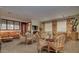 Clubhouse with rattan chairs, glass tables, sofa, and large windows at 6900 E Princess Dr # 1176, Phoenix, AZ 85054