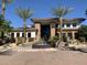 The attractive clubhouse entrance has a fountain, lush landscaping, and handicapped parking at 6900 E Princess Dr # 1176, Phoenix, AZ 85054
