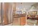 Gourmet kitchen with a stylish backsplash, stainless steel appliances, and a seamless view into the adjacent living room at 6900 E Princess Dr # 1176, Phoenix, AZ 85054