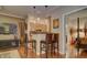 Open-concept space with bar stool seating that connects the kitchen to the living room and bedroom, offering versatile living at 6900 E Princess Dr # 1176, Phoenix, AZ 85054