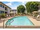 Community pool features mature trees and plenty of space for residents to relax at 6900 E Princess Dr # 1176, Phoenix, AZ 85054