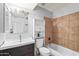 Updated bathroom featuring single sink vanity, updated tile, and built in shelving for storage at 8125 N 32Nd Dr, Phoenix, AZ 85051