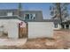 Well-maintained townhouse displaying a private gated entrance, with a brick wall and a peek at the upstairs windows at 8125 N 32Nd Dr, Phoenix, AZ 85051