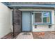 Inviting front door with blue trim, and exterior lighting for curb appeal at 8125 N 32Nd Dr, Phoenix, AZ 85051