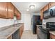 Functional kitchen featuring classic appliances, cabinets, and countertops at 8125 N 32Nd Dr, Phoenix, AZ 85051