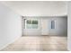Bright living area with neutral paint, tile floors, and outdoor access at 8125 N 32Nd Dr, Phoenix, AZ 85051
