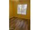 Bedroom with a window providing natural light and hardwood flooring at 818 S Westwood -- # 233, Mesa, AZ 85210