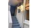 Home entrance featuring gray stairs, an entrance door, and the unit number at 818 S Westwood -- # 233, Mesa, AZ 85210