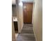 Hallway with wood flooring leading to a bathroom featuring a vanity at 818 S Westwood -- # 233, Mesa, AZ 85210