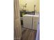 Efficient laundry room features a washer, dryer, and water heater on durable flooring at 818 S Westwood -- # 233, Mesa, AZ 85210