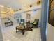 Bright living room with neutral walls, tile flooring, and modern decor at 8742 W Edgemont Ave, Phoenix, AZ 85037