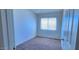 Simple bedroom with carpet, and natural light streaming through a window at 948 S Alma School Rd # 71, Mesa, AZ 85210