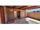Private patio space with covered pergola and block wall, and door leading inside at 948 S Alma School Rd # 71, Mesa, AZ 85210