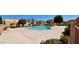 Community pool area surrounded by desert landscaping and several apartment buildings at 948 S Alma School Rd # 71, Mesa, AZ 85210