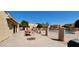 Community pool area featuring picnic tables, a pool, and adjacent buildings at 948 S Alma School Rd # 71, Mesa, AZ 85210