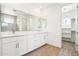 A well-lit bathroom features double sinks and vanity with a glass shower at 10241 E Ursula Ave, Mesa, AZ 85212