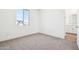 A bright bedroom offers a view of the neighborhood and an attached bathroom at 10241 E Ursula Ave, Mesa, AZ 85212