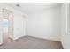 A spacious bedroom features a sliding closet and a view of the outdoors at 10241 E Ursula Ave, Mesa, AZ 85212