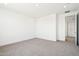 A spacious bedroom offers plush carpet, neutral walls, and recessed lighting at 10241 E Ursula Ave, Mesa, AZ 85212
