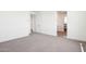 A bright bedroom features neutral walls, plush carpet, and modern trim at 10241 E Ursula Ave, Mesa, AZ 85212