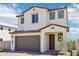 Charming two-story home with a neutral color scheme, two-car garage, and landscaped front yard at 10241 E Ursula Ave, Mesa, AZ 85212