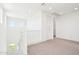 Bright hallway with white walls and carpeted floors leads to bedrooms; natural light filters in at 10241 E Ursula Ave, Mesa, AZ 85212