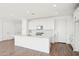 Bright kitchen features white cabinets, a large island, and stainless steel appliances at 10241 E Ursula Ave, Mesa, AZ 85212
