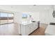 Beautiful kitchen with stainless steel appliances, white cabinets and a large island with sink at 10241 E Ursula Ave, Mesa, AZ 85212