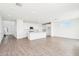 Bright, open-concept kitchen featuring white cabinets, stainless appliances, and a large island with seating at 10241 E Ursula Ave, Mesa, AZ 85212