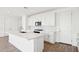 Modern kitchen features white cabinetry, quartz countertops, and stainless steel appliances at 10241 E Ursula Ave, Mesa, AZ 85212