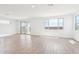 Bright, open-concept living room featuring tile floors, lots of natural light, and access to the backyard at 10241 E Ursula Ave, Mesa, AZ 85212