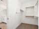 A walk-in closet offers built-in shelving and ample storage at 10241 E Ursula Ave, Mesa, AZ 85212