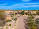 Stunning aerial view showcasing the circular driveway and desert landscaping of the home at 10267 E Cinder Cone Trl, Scottsdale, AZ 85262