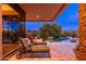 Secluded backyard patio with lounge chairs and a tranquil pool and spa area at 10267 E Cinder Cone Trl, Scottsdale, AZ 85262
