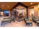 Relaxing back patio featuring comfortable lounge chairs and view into the living room at 10267 E Cinder Cone Trl, Scottsdale, AZ 85262