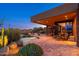 Tranquil backyard oasis featuring a pool, spa, outdoor seating, and lush desert landscaping at 10267 E Cinder Cone Trl, Scottsdale, AZ 85262