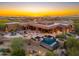 Outdoor oasis with sparkling pool, spa, covered patio and mountain views at 10267 E Cinder Cone Trl, Scottsdale, AZ 85262