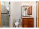 Bathroom featuring a toilet, vanity with storage, and a walk-in shower behind a glass door at 10267 E Cinder Cone Trl, Scottsdale, AZ 85262