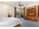 Bedroom with view and built-ins offers outdoor access through a glass door at 10267 E Cinder Cone Trl, Scottsdale, AZ 85262
