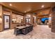 Spacious covered patio with dining and seating areas, leading to the home's interior at 10267 E Cinder Cone Trl, Scottsdale, AZ 85262