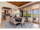 The spacious dining room offers a decorative rug, seating for six, and opens into the kitchen for easy access at 10267 E Cinder Cone Trl, Scottsdale, AZ 85262