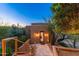 Exterior view of the house featuring desert plants, a stucco wall, and brick steps at 10267 E Cinder Cone Trl, Scottsdale, AZ 85262