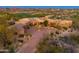 Desert home with professional landscaping and golf course in the background at 10267 E Cinder Cone Trl, Scottsdale, AZ 85262