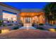 Inviting front entrance with stone accents, desert landscaping, and a grand doorway at 10267 E Cinder Cone Trl, Scottsdale, AZ 85262